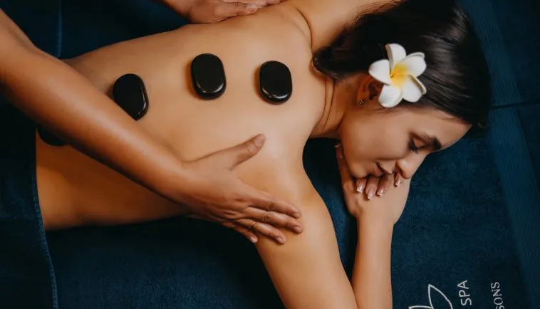 Relaxing hot stone massage in a hotel spa
