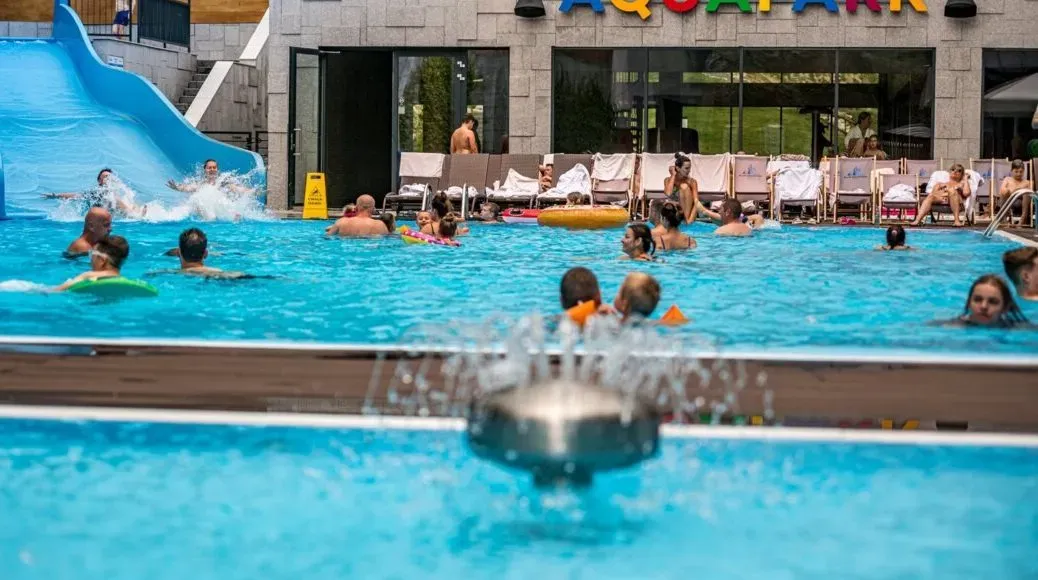 Aquapark pool with water attractions and a slide